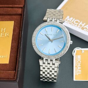 A turquoise mother-of-pearl dial trimmed in pavé crystals adds feminine sparkle to the glamorous stainless-steel Michael Kors Darci watch.